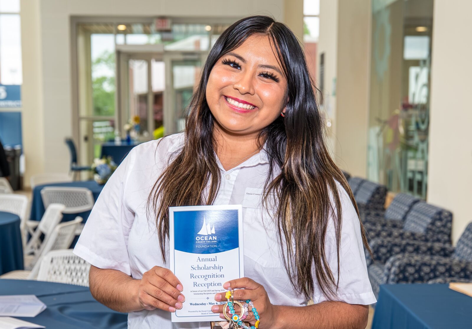 student holding a pamphlet